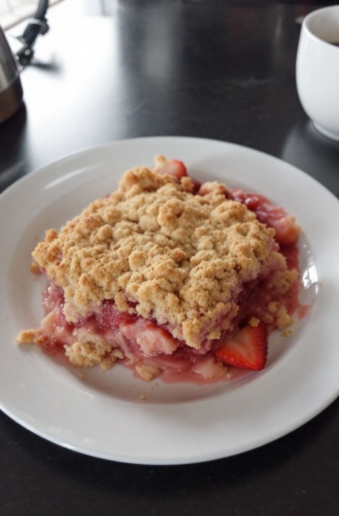 Freshly baked strawberry crumble with golden crispy topping